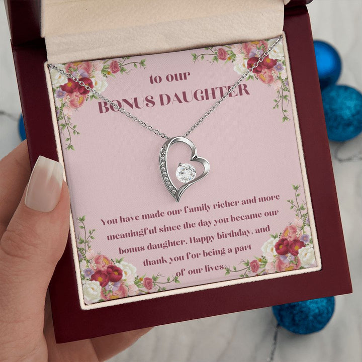 To our Bonus Daughter | You have made our family richer and more meaningful since the day you became our bonus daughter, Happy Birthday! - Forever Love Necklace