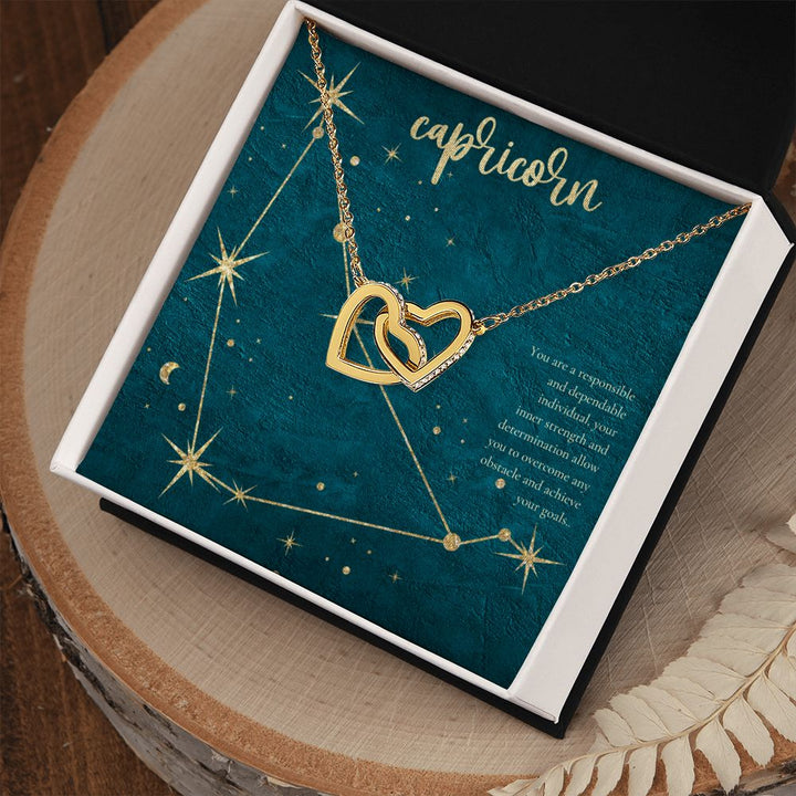 Capricorn | You are a responsible and dependable individual , your inner strenght and determination allow you to overcome any obstacle and achieve you goals. - Interlocking Hearts Necklace