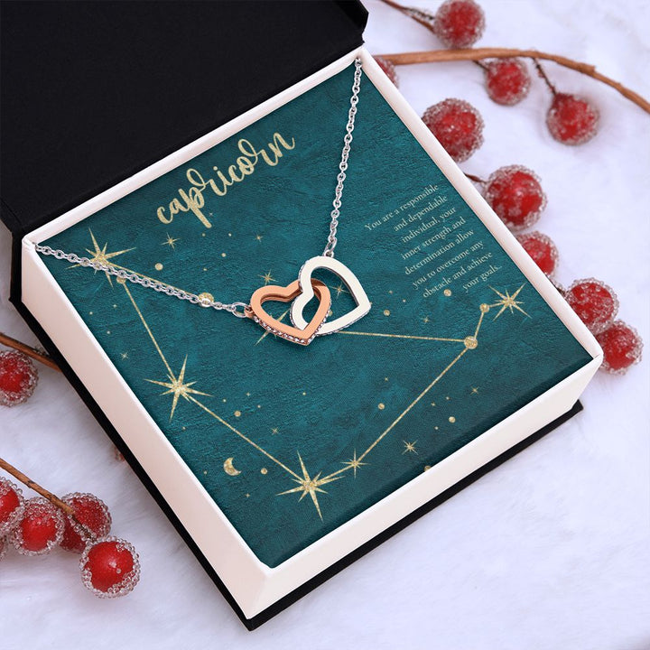 Capricorn | You are a responsible and dependable individual , your inner strenght and determination allow you to overcome any obstacle and achieve you goals. - Interlocking Hearts Necklace