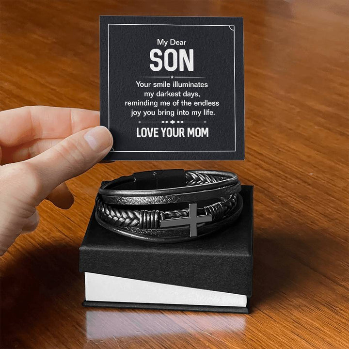 To My Dear Son | Your smile illuminates' my darkest shades - Men's Cross Leather Bracelet