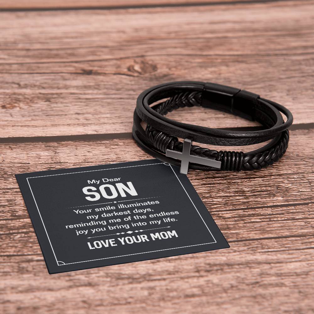 To My Dear Son | Your smile illuminates' my darkest shades - Men's Cross Leather Bracelet