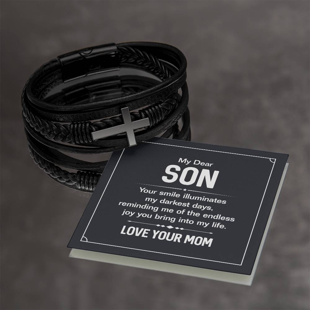 To My Dear Son | Your smile illuminates' my darkest shades - Men's Cross Leather Bracelet