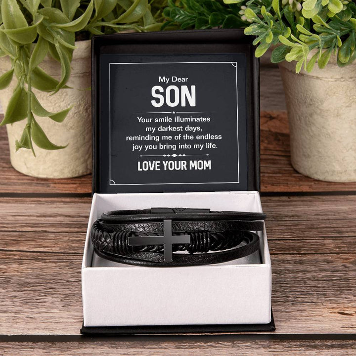 To My Dear Son | Your smile illuminates' my darkest shades - Men's Cross Leather Bracelet