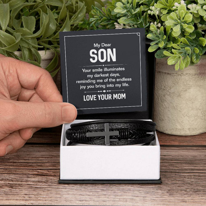 To My Dear Son | Your smile illuminates' my darkest shades - Men's Cross Leather Bracelet