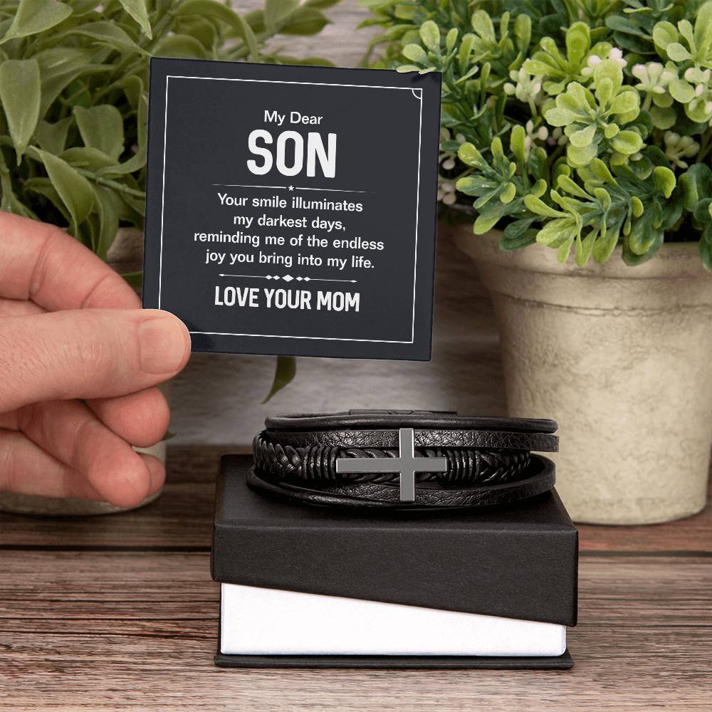 To My Dear Son | Your smile illuminates' my darkest shades - Men's Cross Leather Bracelet