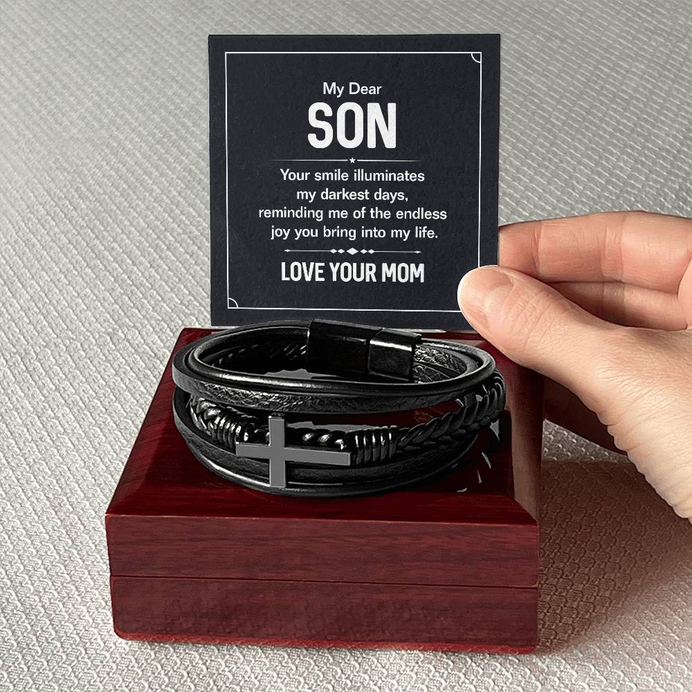 To My Dear Son | Your smile illuminates' my darkest shades - Men's Cross Leather Bracelet