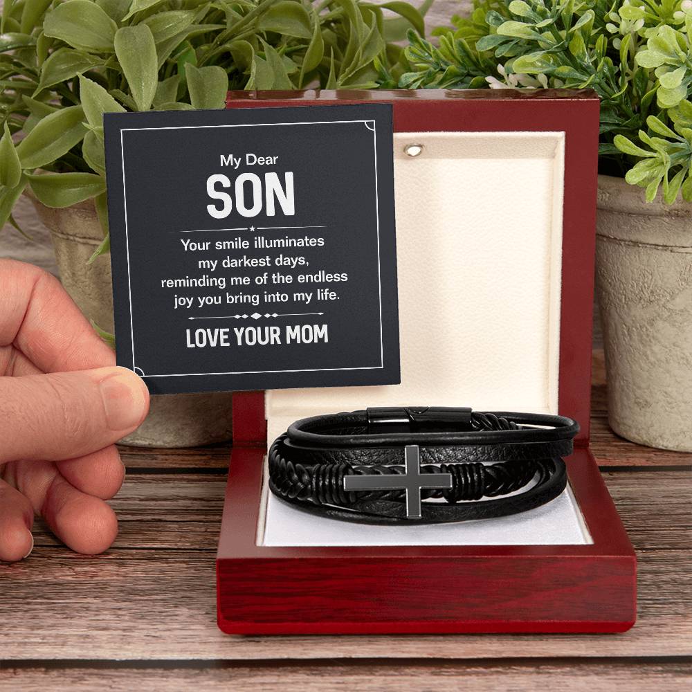 To My Dear Son | Your smile illuminates' my darkest shades - Men's Cross Leather Bracelet