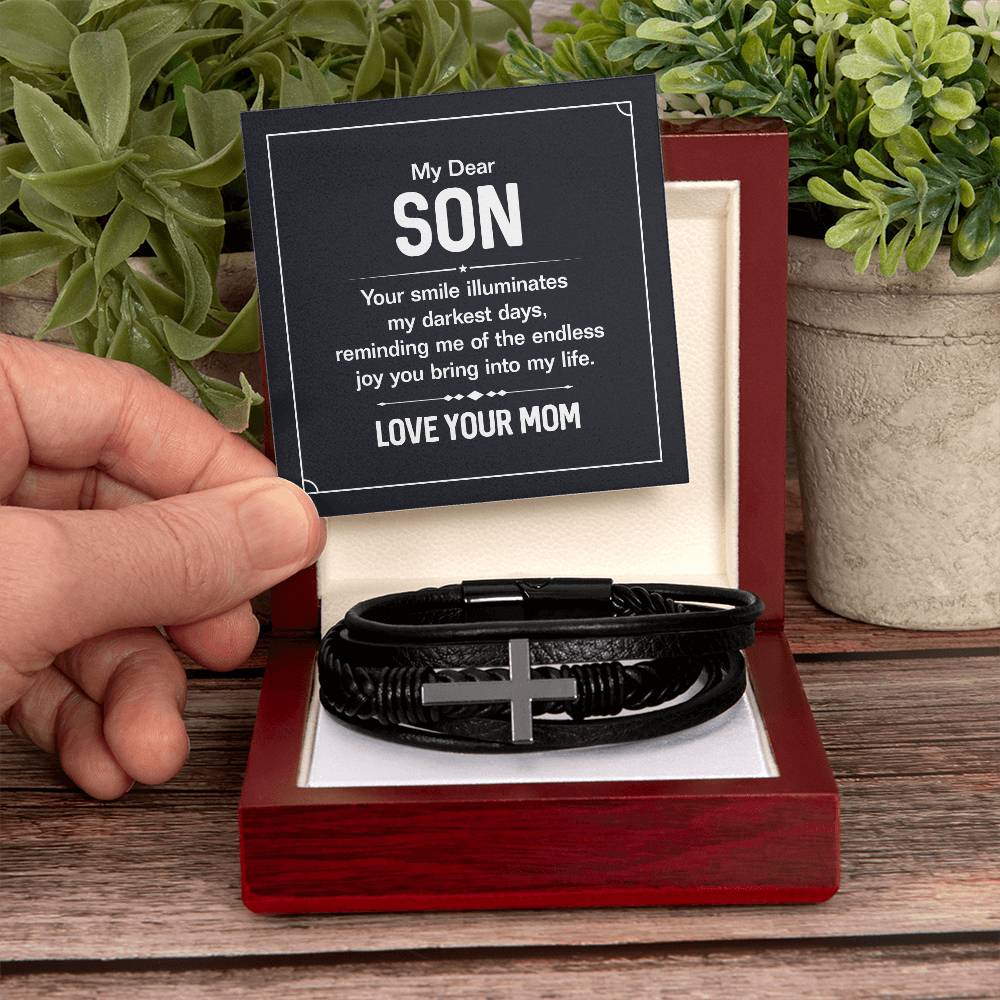 To My Dear Son | Your smile illuminates' my darkest shades - Men's Cross Leather Bracelet