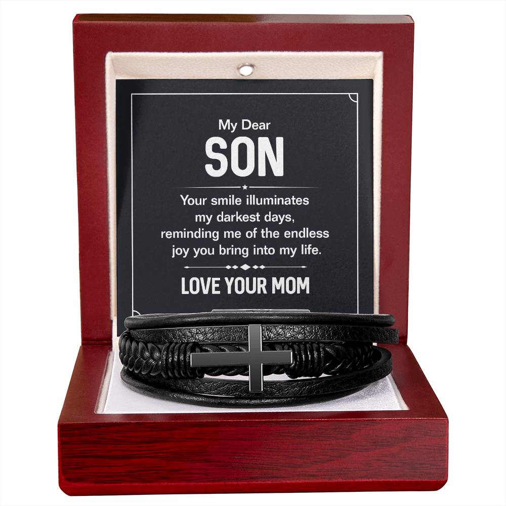 To My Dear Son | Your smile illuminates' my darkest shades - Men's Cross Leather Bracelet